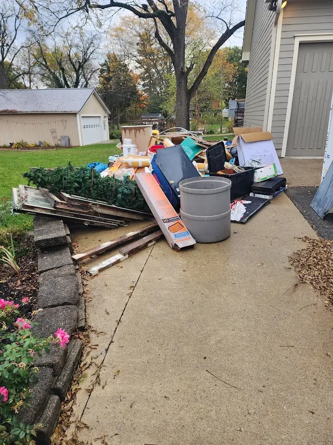 Dumpster being loaded with debris for 30 Yard Dumpster Rental in Watertown